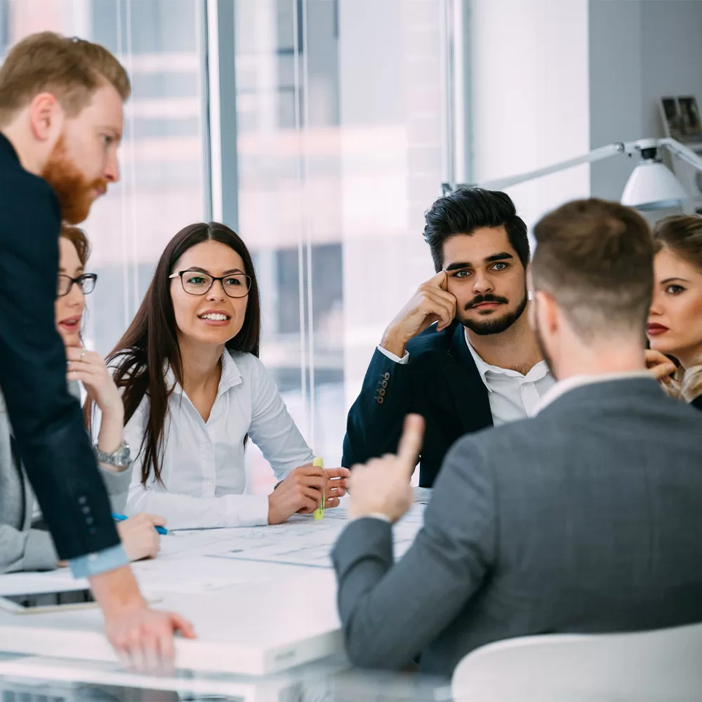 Group of people around table having discussion