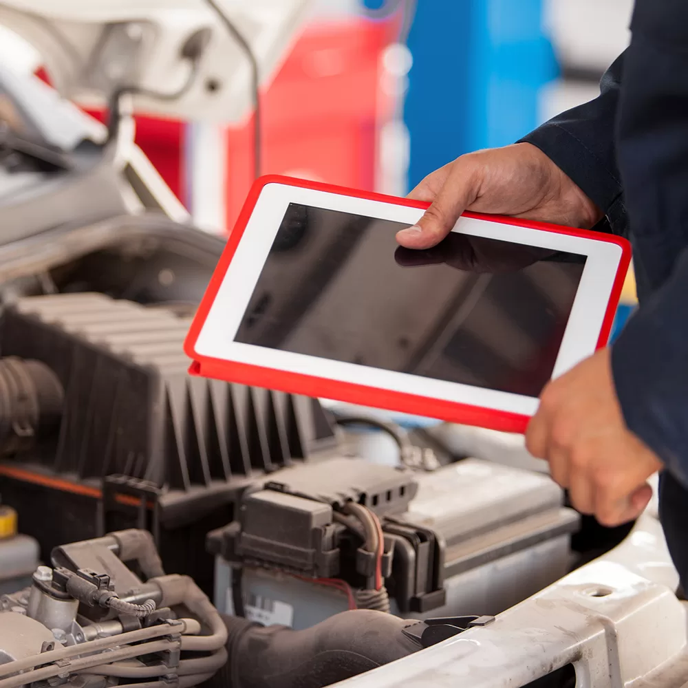 male with iPad performing automotive security testing