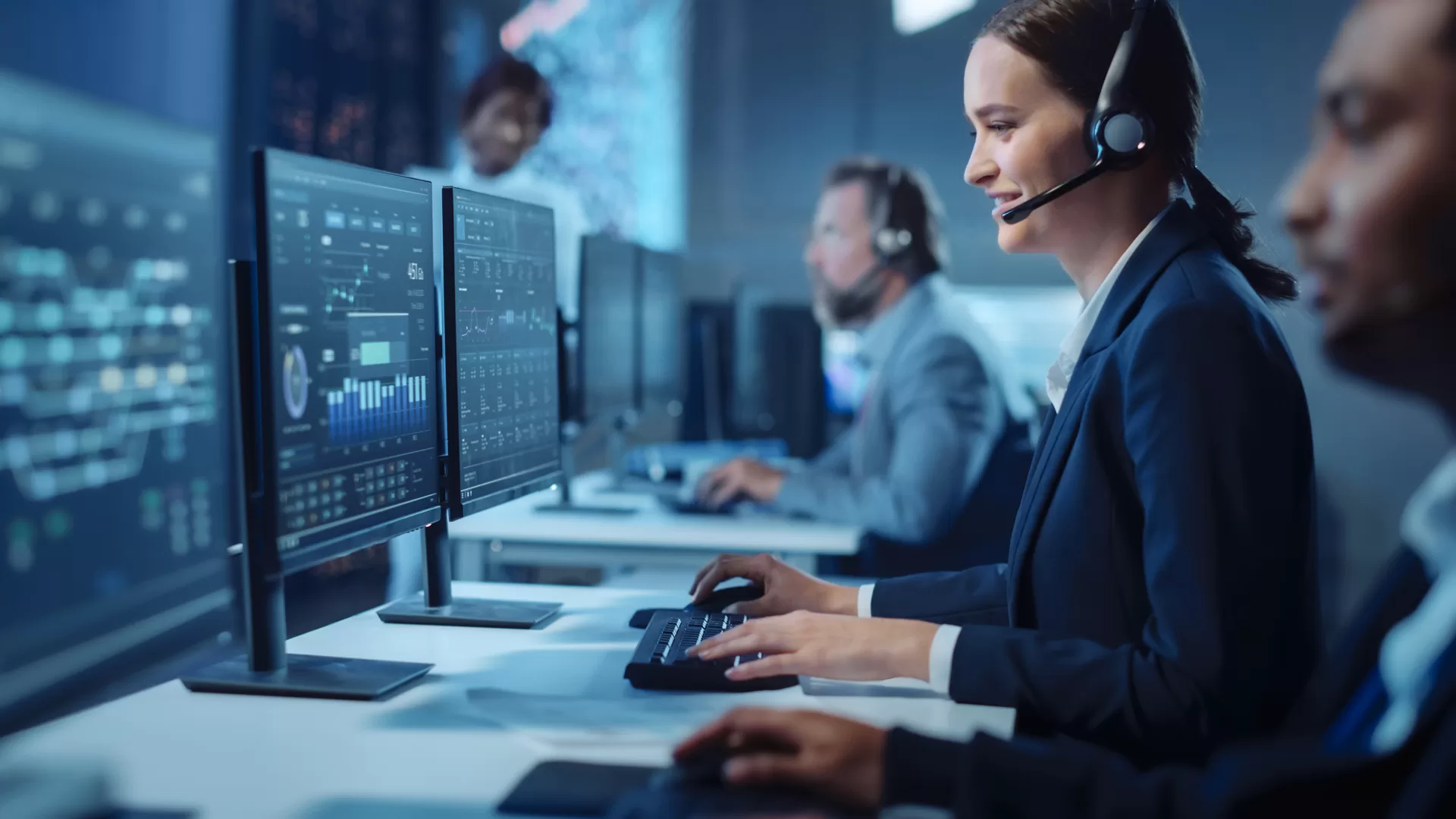 Female Cybersecurity Support Services sitting in front of computer